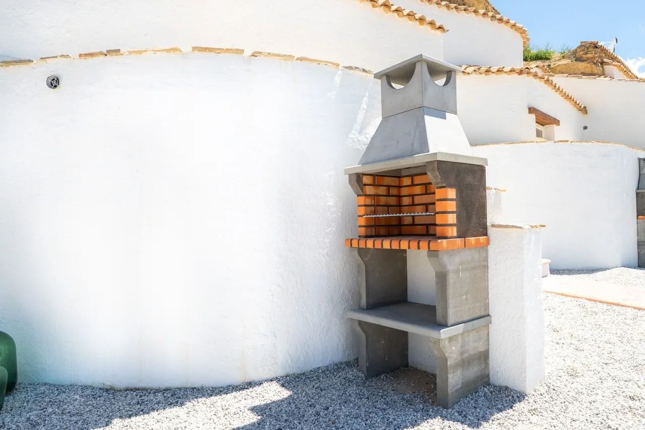 Private outdoor barbecue beside Cueva Alba